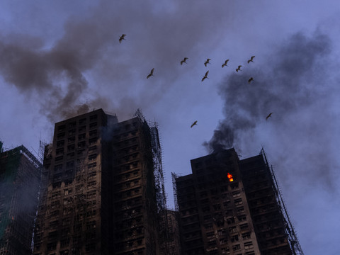 Incendie de Hong Kong: 128 morts selon un nouveau bilan