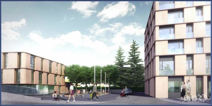 Le nouveau bâtiment doit être construit à côté de l'actuel.