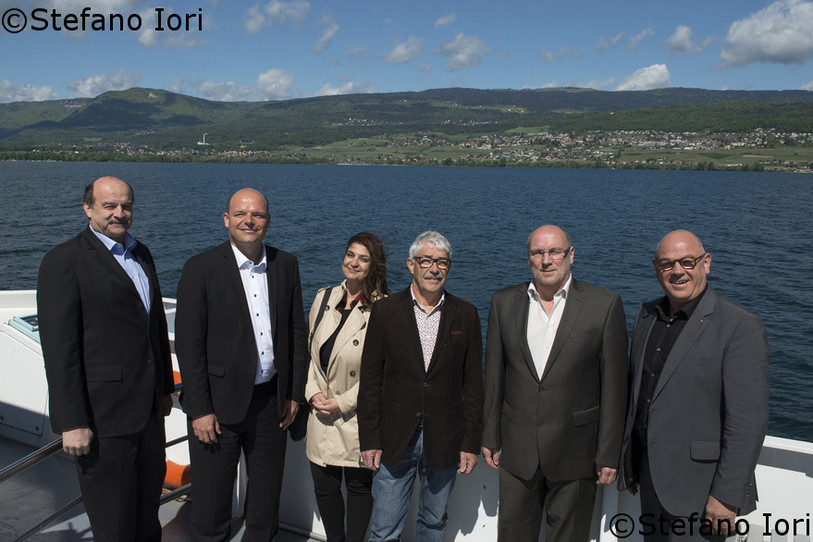 Le projet a été présenté par les conseillers communaux Alain Jeanneret (Saint-Blaise), Olivier Arni (Neuchâtel), Claudia Glauser (Cortaillod), Frédéric Laurent (Milvignes), François Barben (Hauterive) et Jean-Pierre Leuenberger (Boudry).