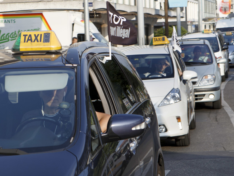 Les taxis genevois perdent une manche au TF contre Uber