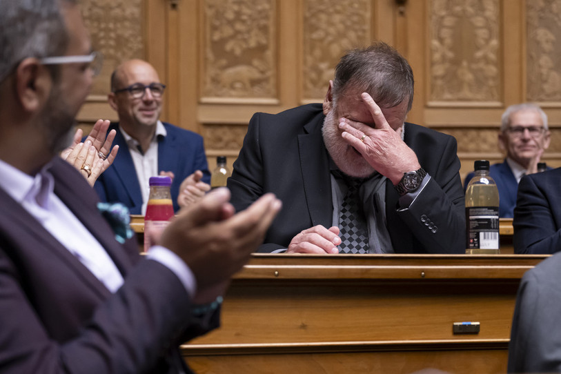 Jean-Paul Gschwind était ému au moment où le Conseil national lui a rendu hommage vendredi dernier. (photo : KEYSTONE/Anthony Anex)