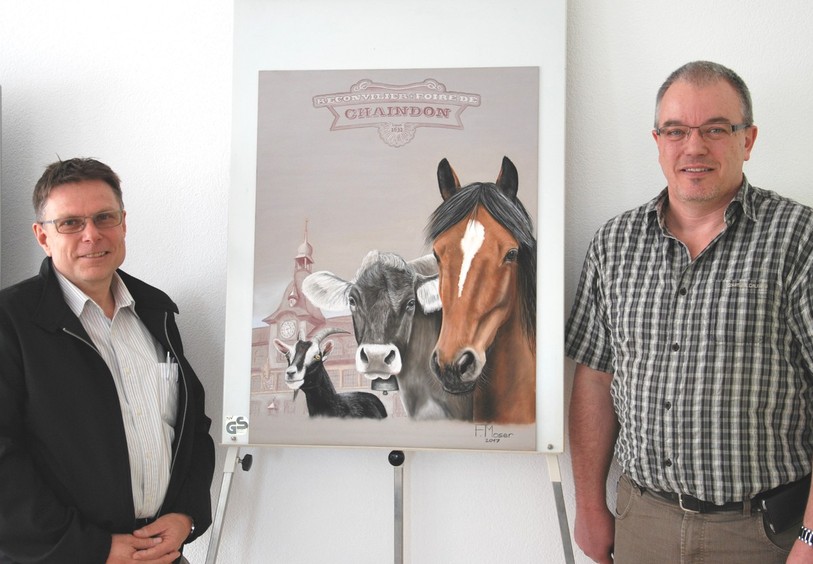 Le président de la Foire de chaindon, Ervin Grünenwald (à g.), et l'artiste Frédéric Moser ont présenté la nouvelle affche vendredi matin