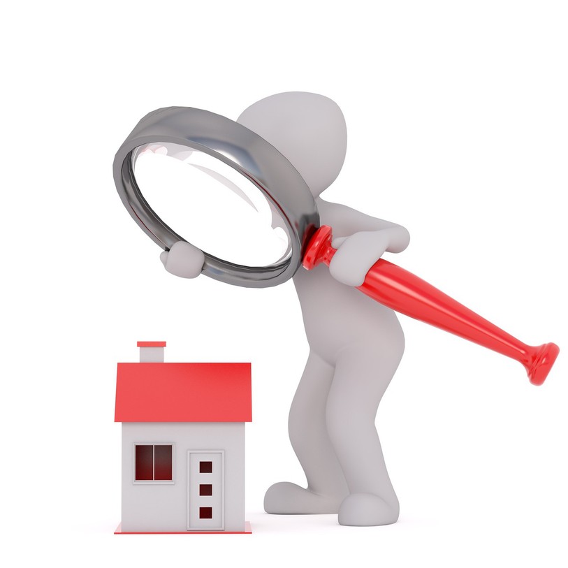 Dessin de maison sous une loupe