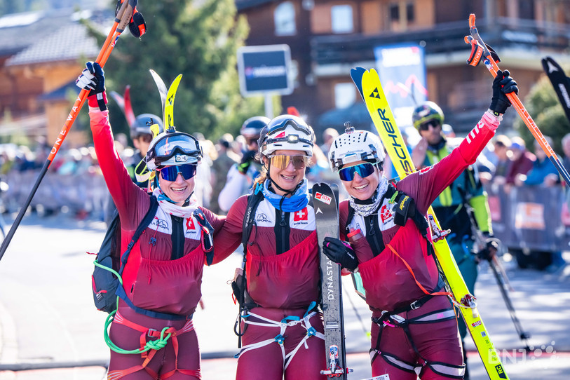 Marianne Fatton, Deborah Marty Chiarello and Maelle Minning of Switzerland, 2nd, left to right, cross the finish line of the Patrouille des Glaciers, one of the toughest ski mountaineering races in the world, which runs from Zermatt to Verbier, where teams prepare to cover more than 50 km and 4,000 m of elevation gain through the high Alps, in Verbier, Saturday, April 18, 2026. (KEYSTONE/Maxime Schmid)