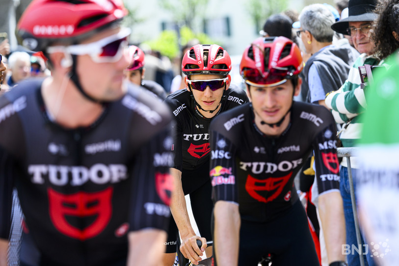 Yannis Voisard, center, from Switzerland of Tudor Pro Cycling Team and Robin Donze, right, from Switzerland of Tudor Pro Cycling Team arrive at the start line ahead of the first stage, a 170,6 km race around Martigny at the 79th Tour de Romandie UCI World Tour Cycling race, in Martigny, Switzerland, Wednesday, April 29, 2026. (KEYSTONE/Jean-Christophe Bott)