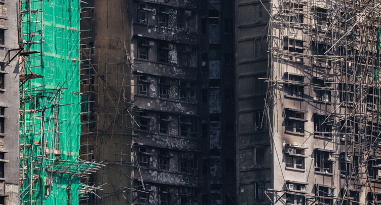 Incendie de Hong Kong: le gouvernement observe 3 minutes de silence image